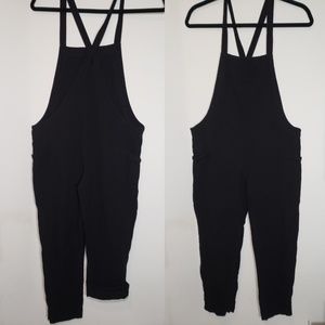 Black romper/ overalls. Cotton blend. Size small